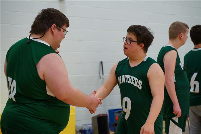Students shake hands following the Pathfinder Panthers Basketball game against the Mon Valley Mustangs on Feb. 22, 2024.
